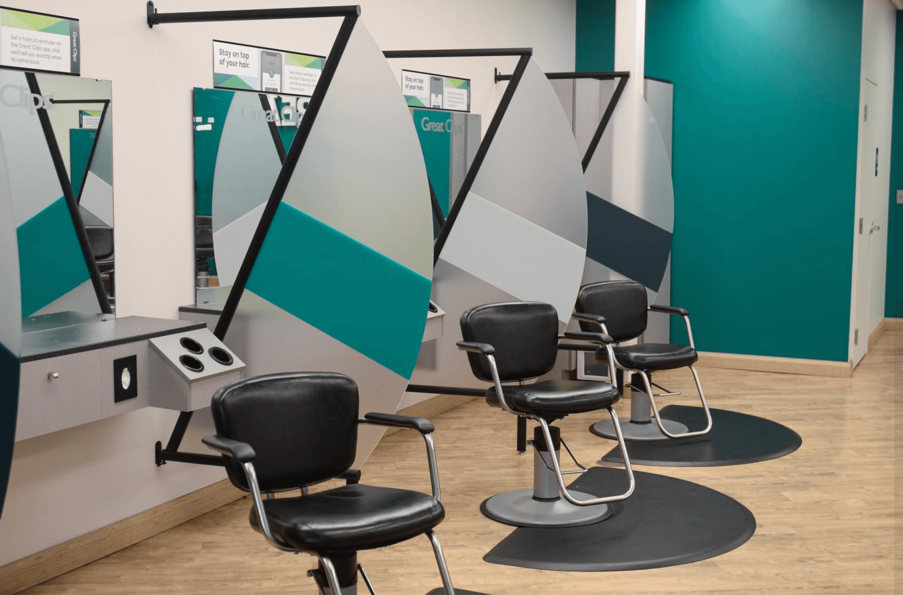 Salon floor with styling chairs and mirrors